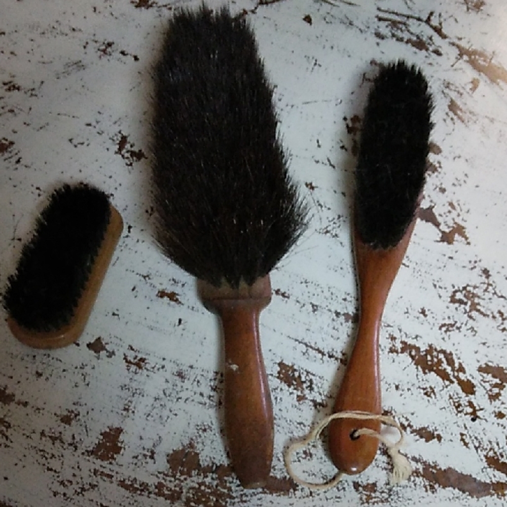 Black and Brown Grooming Tools with Dense Bristles